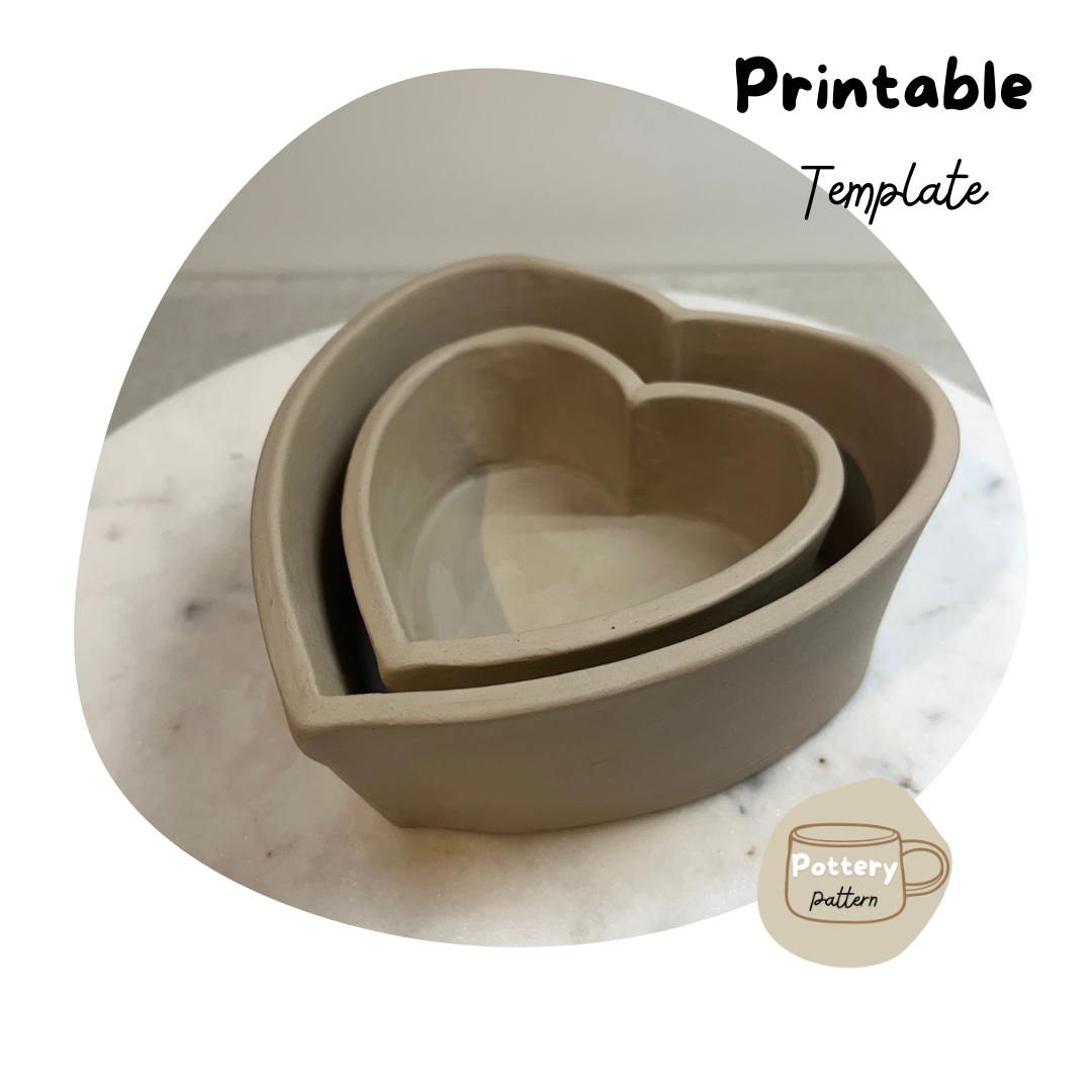 Nested handmade heart-shaped dishes crafted using a printable pottery template. Displayed on a marble surface, these dishes are perfect for creating romantic, cute functional pottery pieces for home décor or gifting. Ideal for beginners and DIY ceramic projects.