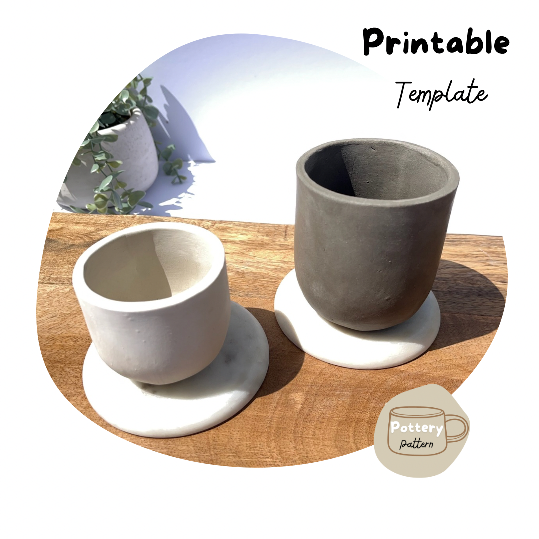 Two handmade ceramic cups, one in white clay the other in darker clay, displayed on a wooden surface with simple, modern design. Part of a printable pottery template for crafting your own custom ceramic cups. 