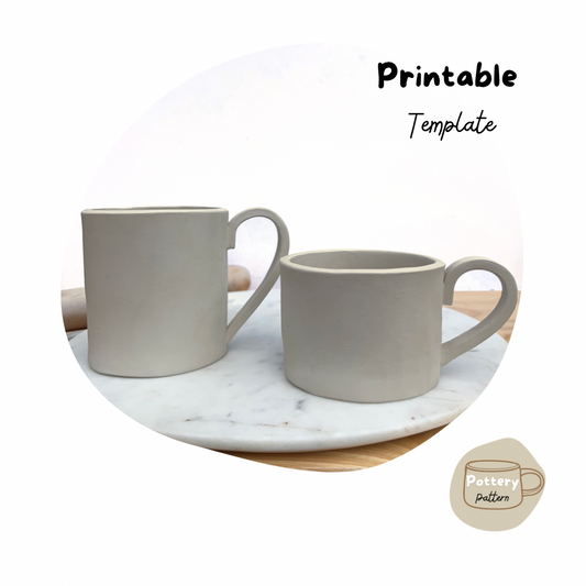 two handmade pottery mugs crafted using printable pottery templates. Displayed on a marble surface, these ceramic mugs feature sleek handles and smooth edges, ideal for DIY pottery project. Perfect for creating pottery projects at home. 